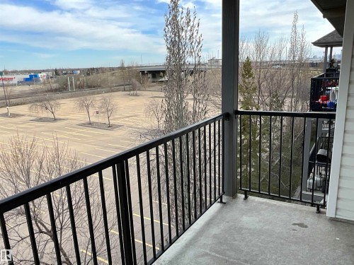 Outdoor balcony featuring a black metal railing and concrete flooring - 408 309 Clareview Station Drive Nw, Edmonton, AB - Outdoor With Balcony