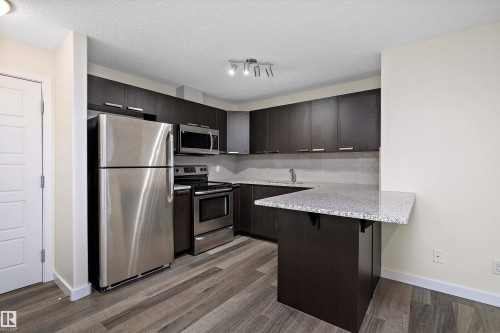 323 14808 125 Street, Edmonton, AB - Indoor Photo Showing Kitchen With Stainless Steel Kitchen With Upgraded Kitchen