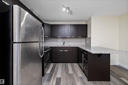 323 14808 125 Street, Edmonton, AB - Indoor Photo Showing Kitchen With Stainless Steel Kitchen With Upgraded Kitchen