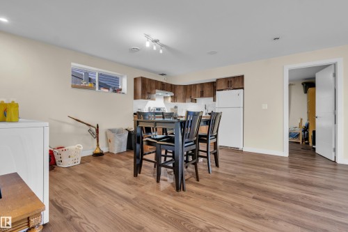 This property features durable wood-look flooring throughout the main living area - 3071 Carpenter Landing Landing, Edmonton, AB - Indoor