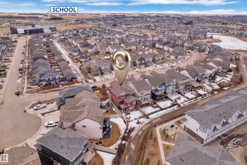 Aerial view of a residential neighbourhood with a variety of housing styles, including detached properties and townhomes - 3071 Carpenter Landing Landing, Edmonton, AB - Outdoor With View