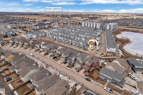 Aerial view of the neighborhood, highlighting the property's location within a residential area featuring detached homes and townhouses - 3071 Carpenter Landing Landing, Edmonton, AB - Outdoor With View