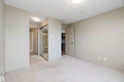 The property features carpeted flooring, neutral wall paint, and overhead lighting - 