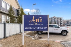 Signage for the Summerside Condos with the address 4008 Savaryn Drive SW, indicating the property location - 