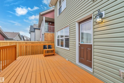 The property features an outdoor deck with wooden fencing, offering an inviting extension of the living space - 607 Allard Boulevard, Edmonton, AB - Outdoor With Exterior