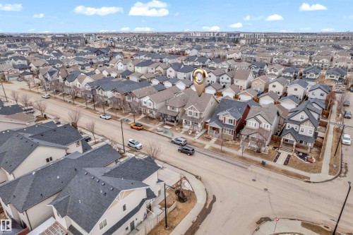 Aerial view of the property and its surrounding residential area, featuring a street lined with houses and a clear sky overhead - 607 Allard Boulevard, Edmonton, AB - Outdoor With View