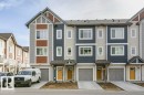The property features a multi-level design with siding in shades of grey, blue, and brown - 99 320 Secord Boulevard, Edmonton, AB  - Outdoor With Facade 