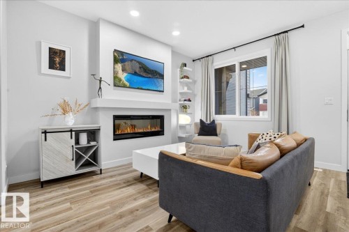 535 Paterson Way, Edmonton, AB - Indoor Photo Showing Living Room With Fireplace