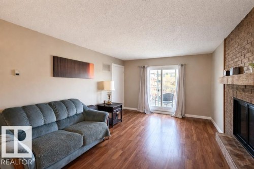 308 10136 160 Street Nw, Edmonton, AB - Indoor Photo Showing Living Room With Fireplace