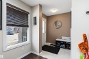 Entryway featuring a window with dark blinds, a white door, and tiled flooring - 6822 Cardinal Link, Edmonton, AB  - Indoor Photo Showing Other Room 