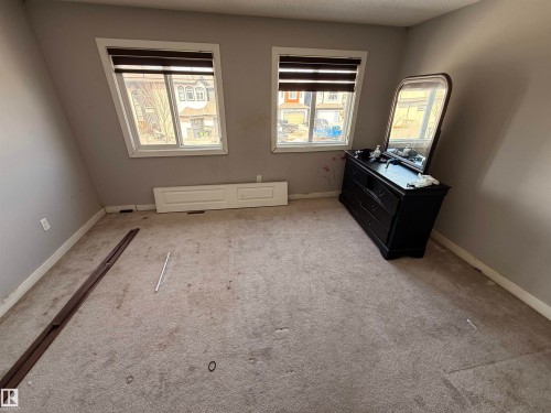 This room features two windows with blinds, allowing for natural light - 3317 11 Avenue, Edmonton, AB - Indoor