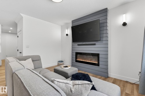 127 Hilton Cove, Spruce Grove, AB - Indoor Photo Showing Living Room With Fireplace
