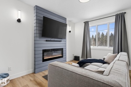 127 Hilton Cove, Spruce Grove, AB - Indoor Photo Showing Living Room With Fireplace