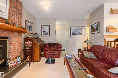 45 Wimbleton Crescent, St. Albert, AB - Indoor Photo Showing Living Room With Fireplace