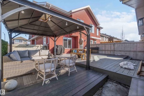 The property features an outdoor patio with a gazebo, a multi-level deck, and a wooden fence - 4750 Crabapple Run, Edmonton, AB - Outdoor With Deck Patio Veranda With Exterior