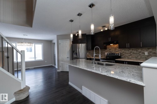 6938 23 Avenue, Edmonton, AB - Indoor Photo Showing Kitchen With Double Sink With Upgraded Kitchen