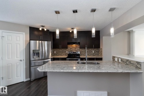 6938 23 Avenue, Edmonton, AB - Indoor Photo Showing Kitchen With Double Sink With Upgraded Kitchen