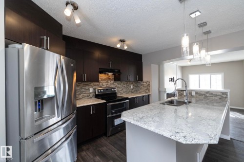 6938 23 Avenue, Edmonton, AB - Indoor Photo Showing Kitchen With Double Sink With Upgraded Kitchen