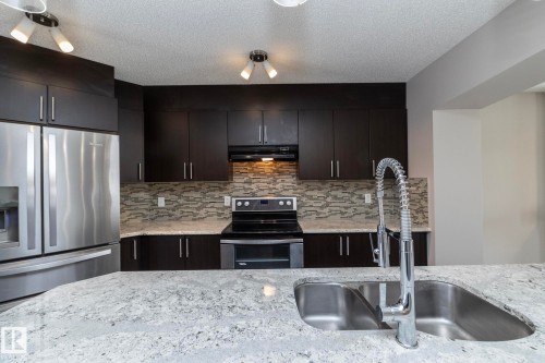 6938 23 Avenue, Edmonton, AB - Indoor Photo Showing Kitchen With Double Sink With Upgraded Kitchen