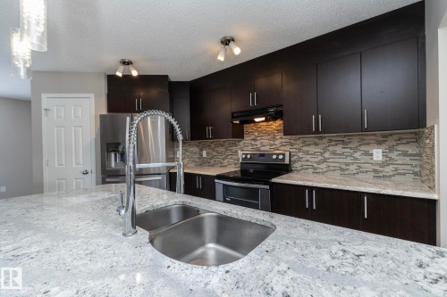 6938 23 Avenue, Edmonton, AB - Indoor Photo Showing Kitchen With Double Sink With Upgraded Kitchen