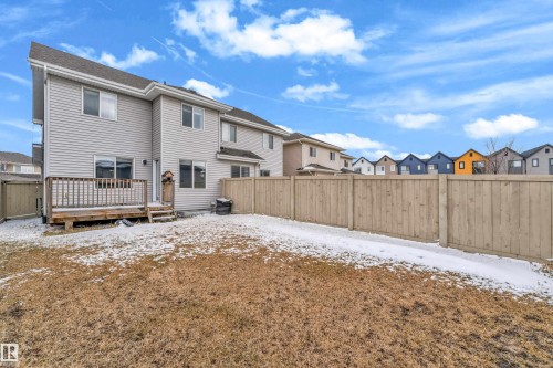 This property features a private backyard with a wooden fence and a wooden deck - 4416 6 Street, Edmonton, AB - Outdoor With Deck Patio Veranda