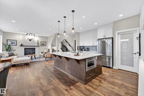 38 Eternity Crescent, St. Albert, AB - Indoor Photo Showing Kitchen With Fireplace With Upgraded Kitchen