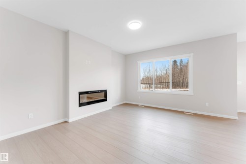 17839 7 St, Edmonton, AB - Indoor Photo Showing Living Room With Fireplace