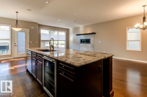 11122 52 Street, Edmonton, AB - Indoor Photo Showing Kitchen With Fireplace With Upgraded Kitchen