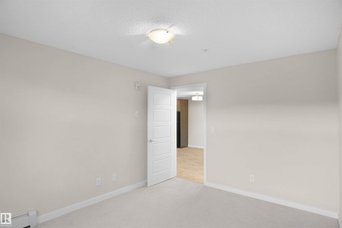 335 6076 Schonsee Way, Edmonton, AB - Indoor Photo Showing Other Room