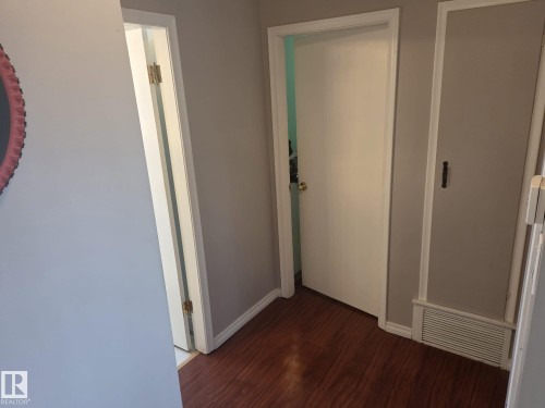 The interior features hardwood flooring and a neutral wall color - 3626 111 Avenue, Edmonton, AB - Indoor Photo Showing Other Room