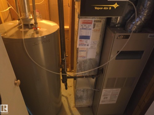The property includes a water heater and a furnace - 3626 111 Avenue, Edmonton, AB - Indoor Photo Showing Basement