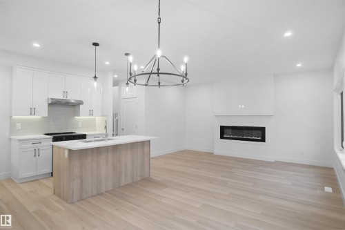 3050 Dixon Landing Landing, Edmonton, AB - Indoor Photo Showing Kitchen With Fireplace With Upgraded Kitchen