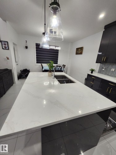 5306 Rue Eaglemont, Beaumont, AB - Indoor Photo Showing Kitchen With Double Sink