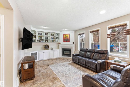10 Harmony Place, St. Albert, AB - Indoor Photo Showing Living Room With Fireplace