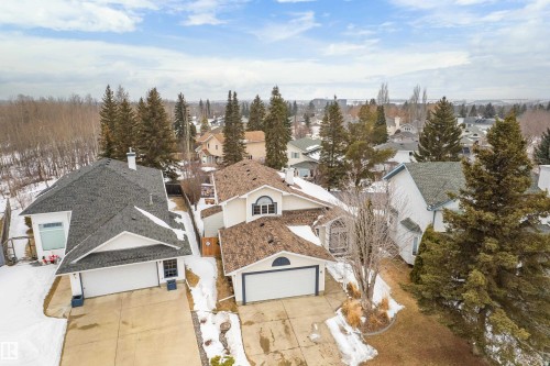 The property features a multi-level design with a prominent front entrance and an attached garage - 10 Harmony Place, St. Albert, AB - Outdoor With View