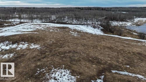 Expansive open land featuring natural terrain and partial snow cover - 57027 Sec Hwy 881, Rural St. Paul County, AB 