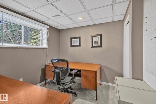 This bedroom space features a window with blinds, carpeted flooring, and a drop ceiling with recessed lighting - 2016 138 Avenue, Edmonton, AB - Indoor Photo Showing Office