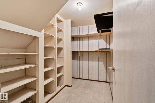 This room offers extensive built-in shelving, providing generous storage solutions - 2016 138 Avenue, Edmonton, AB - Indoor With Storage
