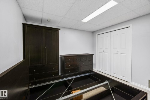 This room features light grey walls and carpeted flooring - 2016 138 Avenue, Edmonton, AB - Indoor Photo Showing Other Room