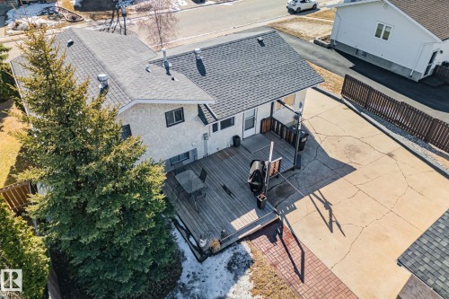 The property features a private deck, a paved driveway, and a fenced yard - 2016 138 Avenue, Edmonton, AB - Outdoor