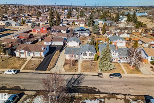 Aerial view of a residential street featuring homes with front yards, driveways, and street parking - 2016 138 Avenue, Edmonton, AB - Outdoor With View