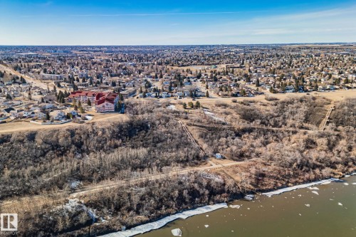 The property is situated in a developed area, surrounded by other residences and natural elements - 2016 138 Avenue, Edmonton, AB - Outdoor With View