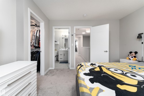 The room features light gray walls, light gray carpet flooring, and white trim - 22742 95A Ave, Edmonton, AB - Indoor Photo Showing Bedroom
