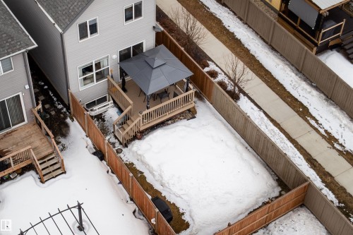 The property features a fenced yard, a wooden deck, and a gazebo - 22742 95A Ave, Edmonton, AB - Indoor Photo Showing Other Room