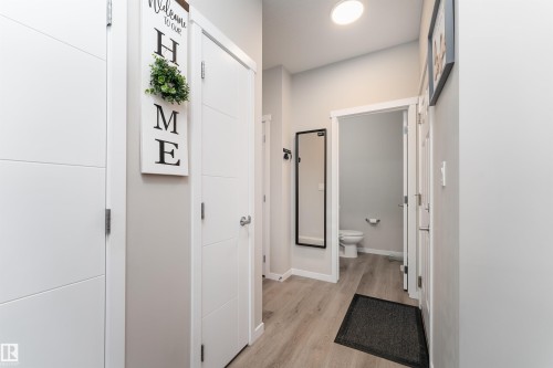 The property features light-colored walls, contemporary white doors, and a ceiling light fixture - 22742 95A Ave, Edmonton, AB - Indoor Photo Showing Other Room
