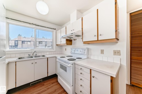 12054 25 Avenue, Edmonton, AB - Indoor Photo Showing Kitchen With Double Sink