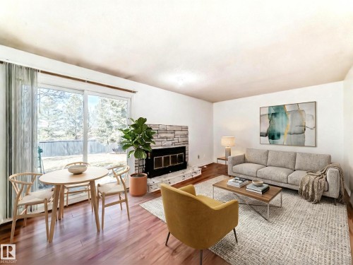 12054 25 Avenue, Edmonton, AB - Indoor Photo Showing Living Room With Fireplace