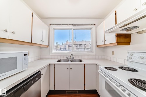 12054 25 Avenue, Edmonton, AB - Indoor Photo Showing Kitchen With Double Sink