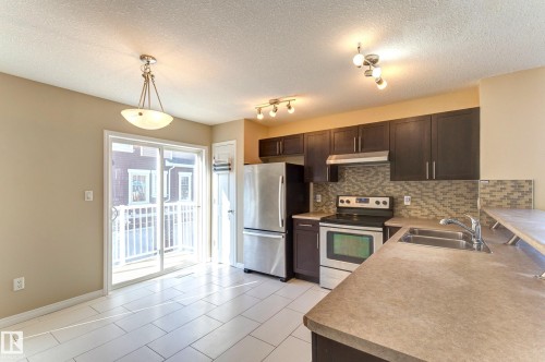 27 1623 Towne Centre Boulevard, Edmonton, AB - Indoor Photo Showing Kitchen With Stainless Steel Kitchen With Double Sink