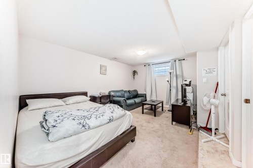 This room features light-colored walls and carpeted flooring - 19024 50 Avenue, Edmonton, AB - Indoor Photo Showing Bedroom